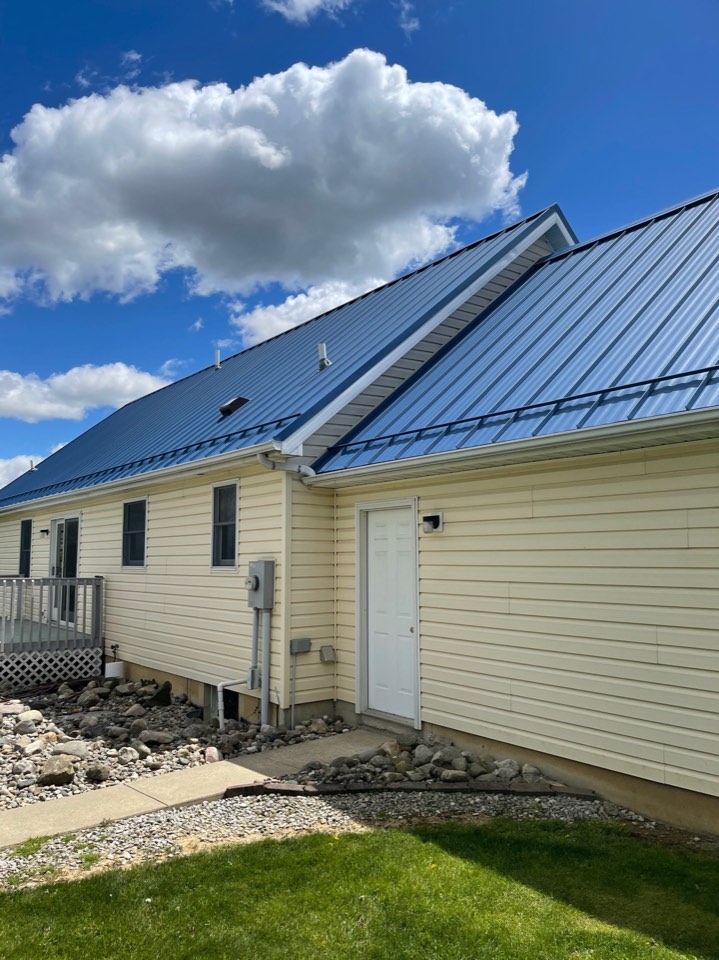 On-roof perspective of Big Dog Roofing technician during active replacement work